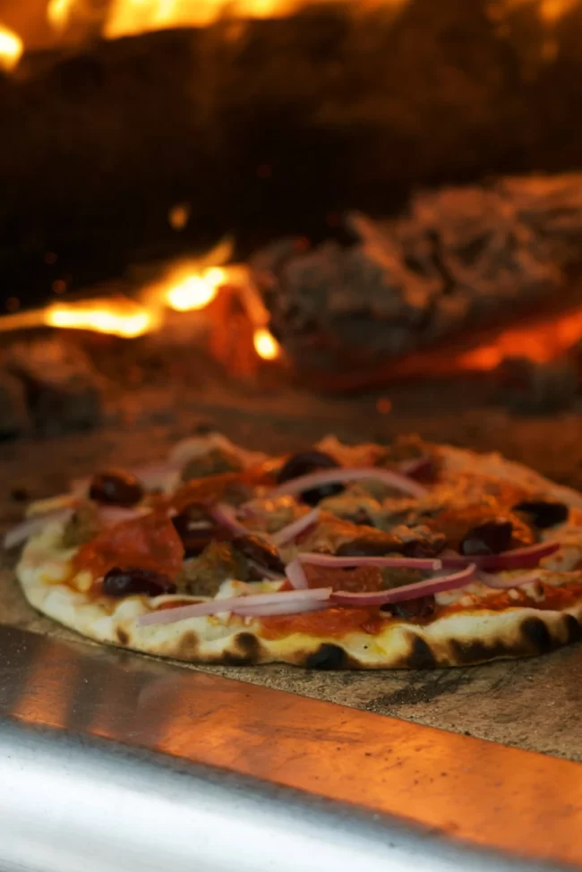 wood fired pizzas in the pizza oven